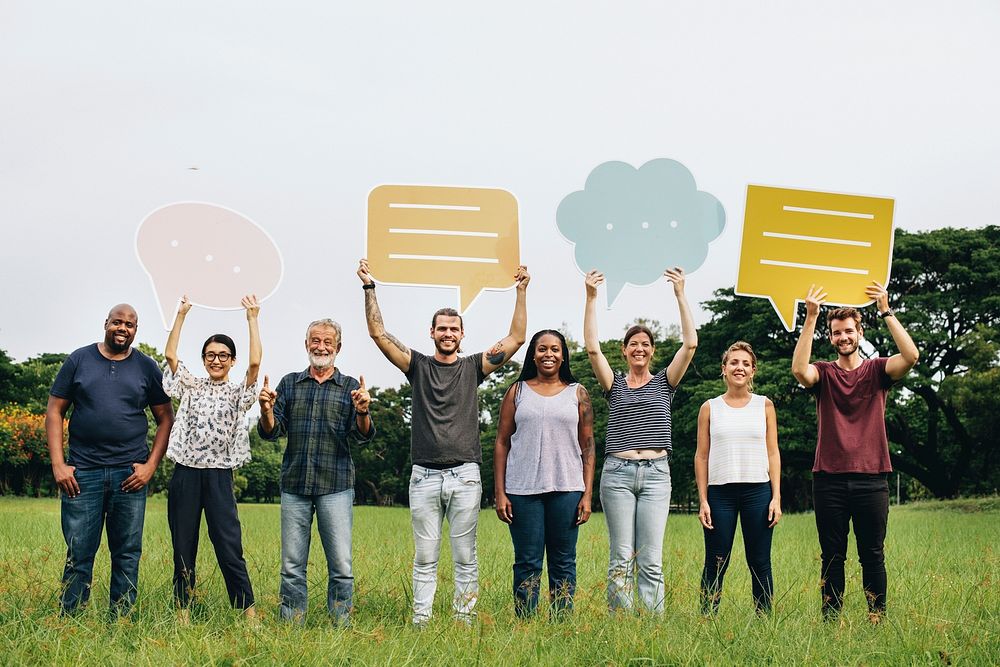 Happy diverse people holding colorful speech bubbles