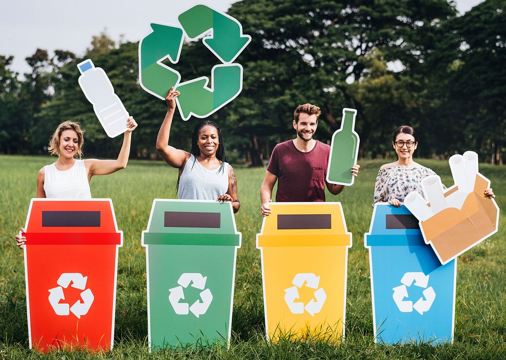 Diverse people with colorful recycle bins