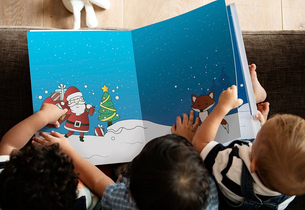Young kids reading a Christmas story together