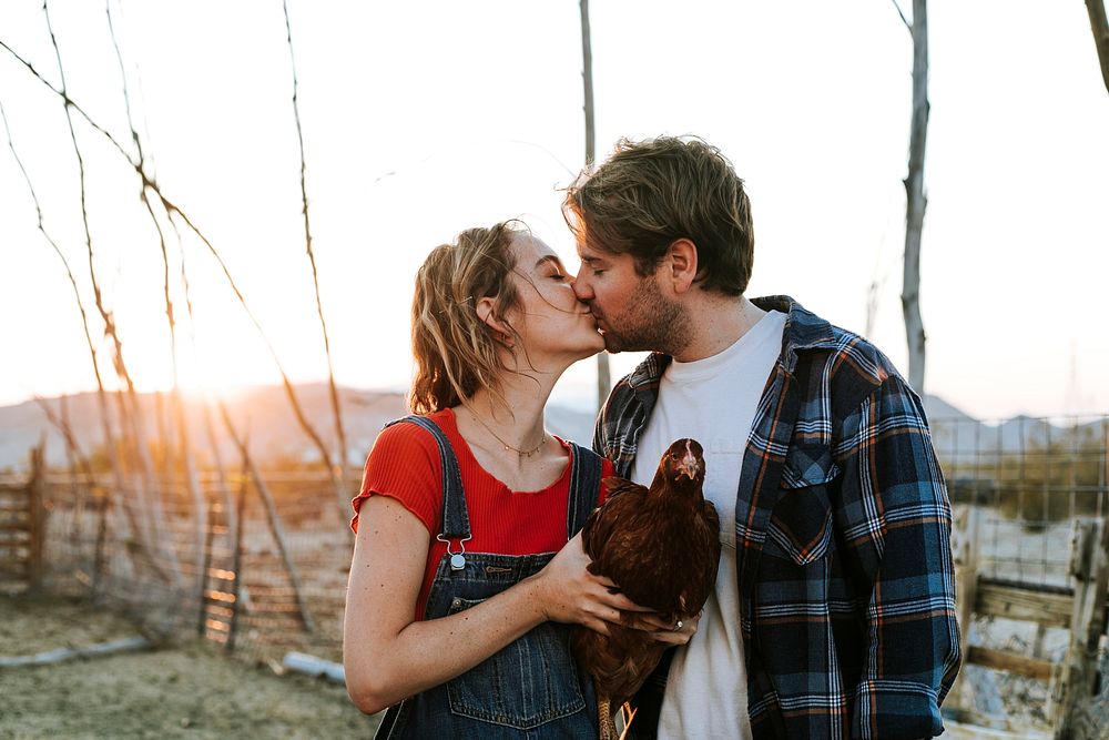 Sweet couple with their pet chicken