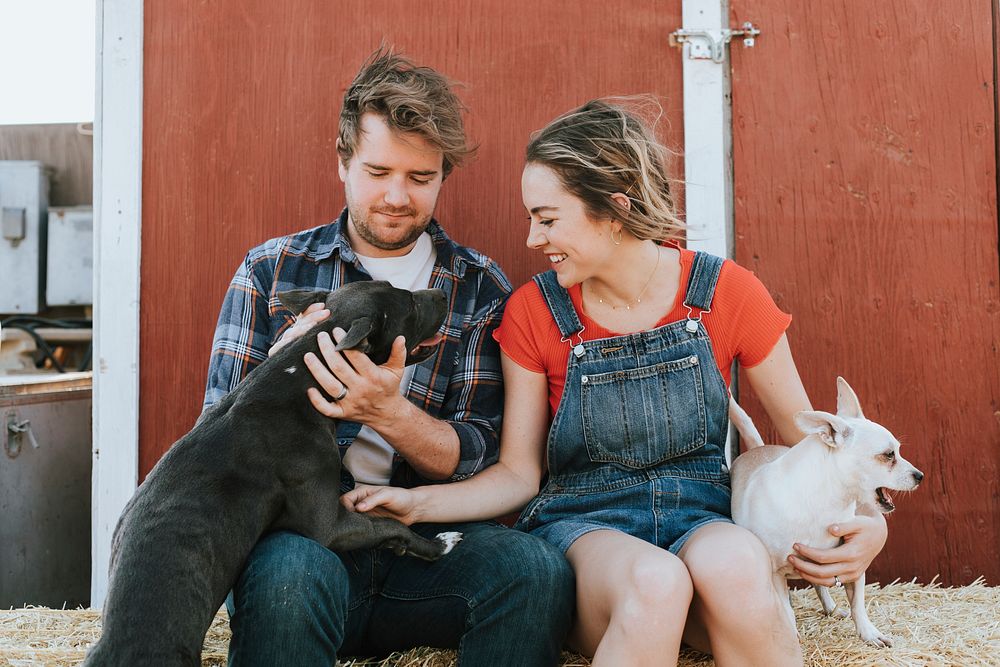 Happy couple living with their rescued dogs