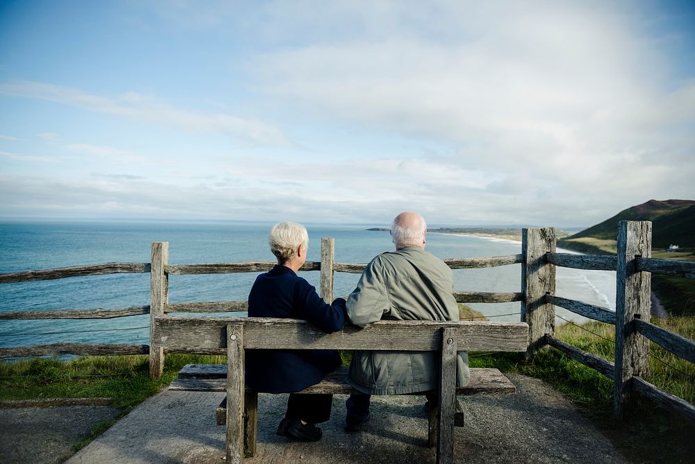 Old couple enjoying the view of the ocean