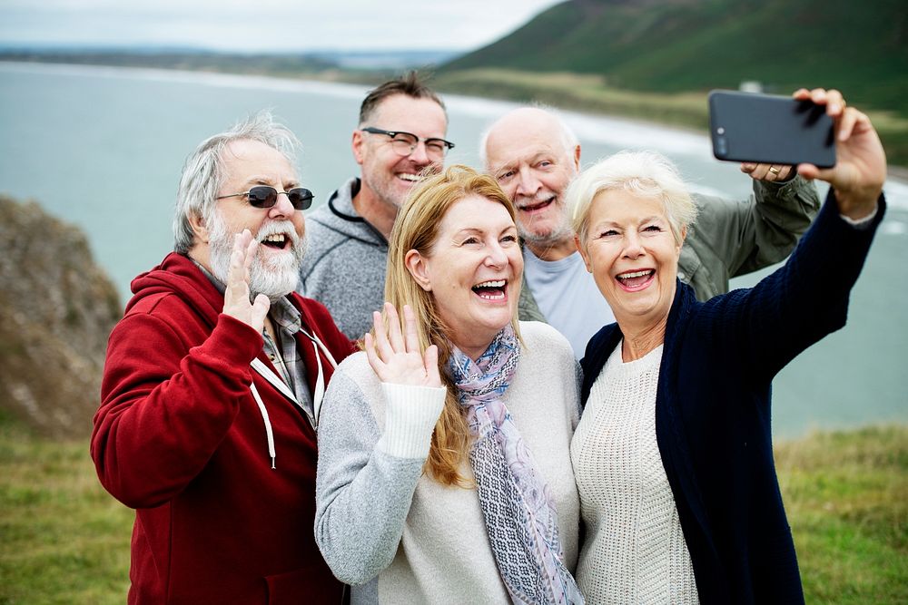 Group of happy seniors taking a selfie