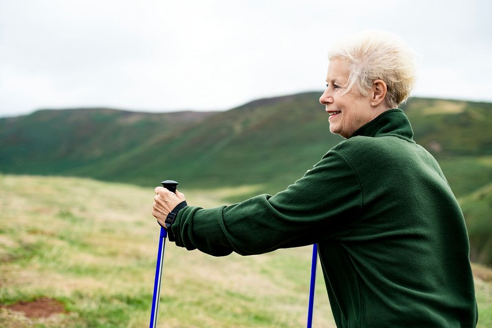 Senior woman with trekking poles