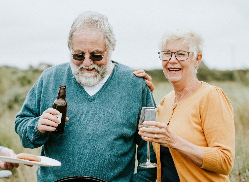 Happy senior couple enjoying a drink