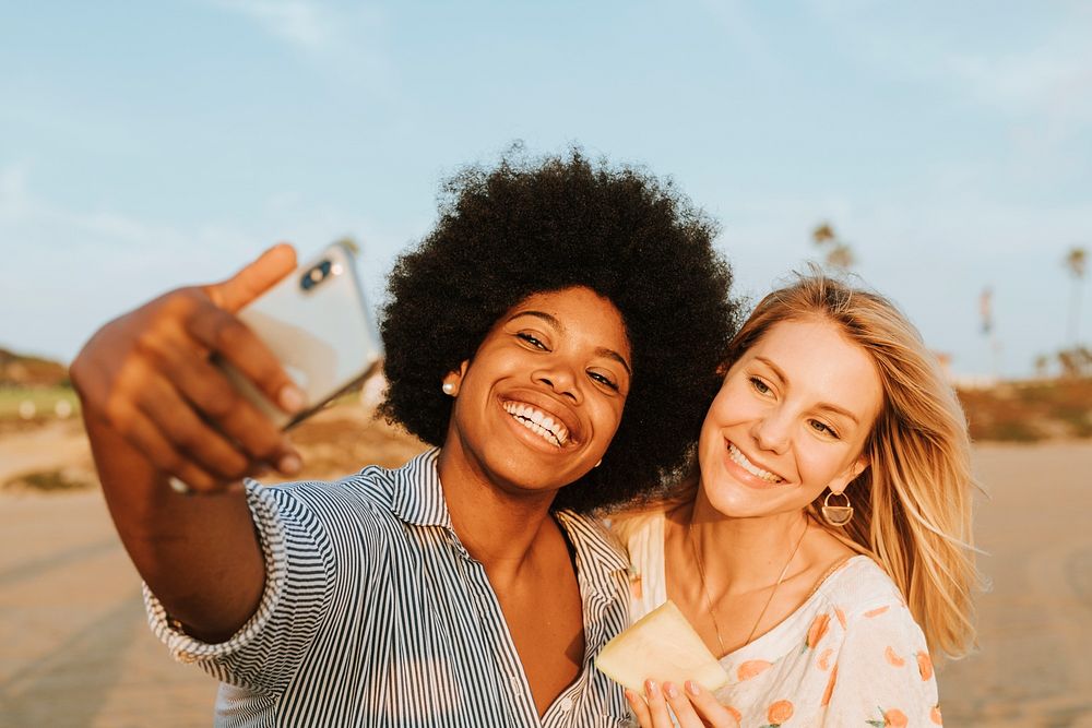 Women taking a selfie at the beach