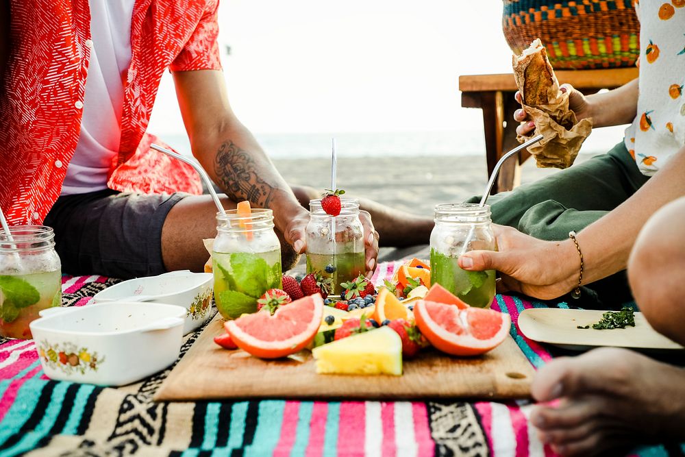 Friends having a beach picnic