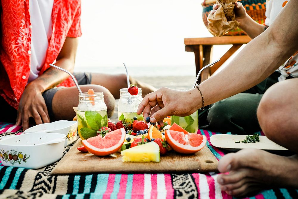 Friends having a beach picnic