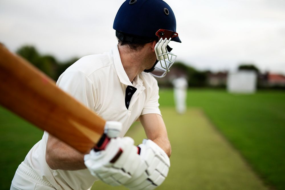 Cricketer on the field in action