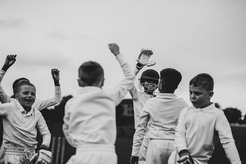 Young cricket players cheering to their victory