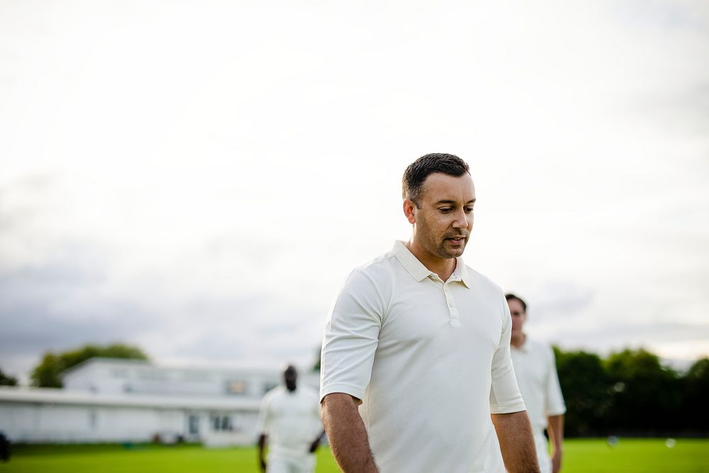 Cricket player dressed in white ready for a match