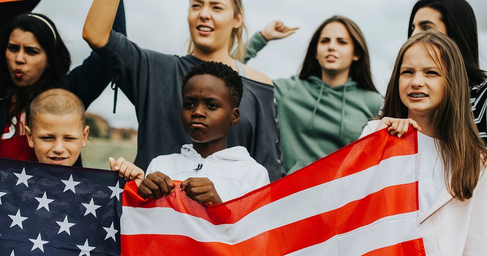 Group of diverse kids showing a US flag in a protest
