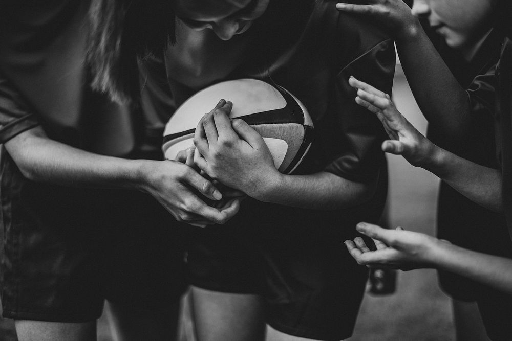 Close up of female rugby player with a ball