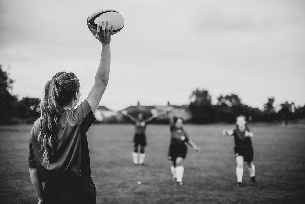 Female rugby player ready to throw the ball