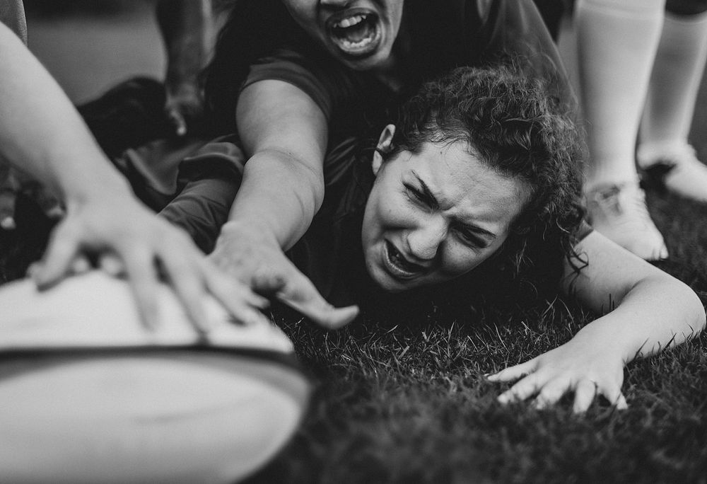 Female rugby players in action