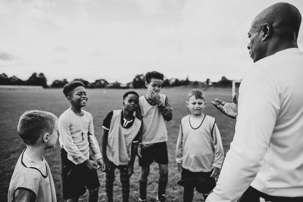 Football coach training his students