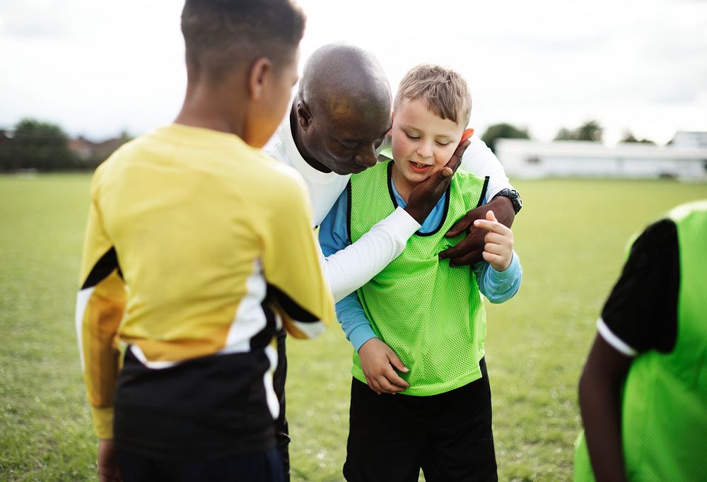 Football coach with his students | Free Photo - rawpixel