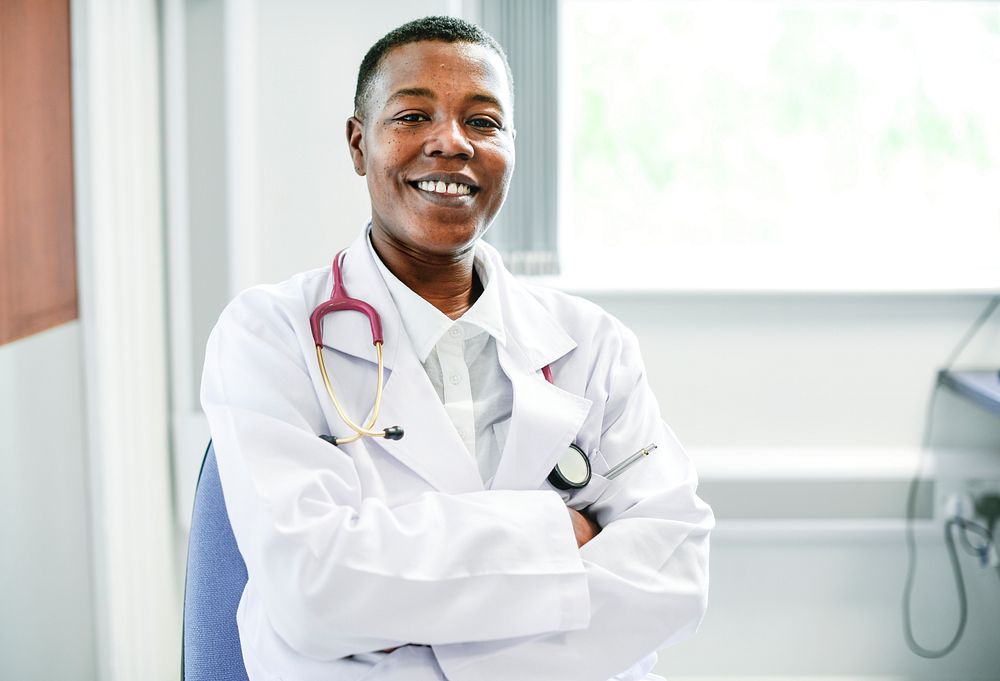 Happy doctor at a hospital | Premium Photo - rawpixel