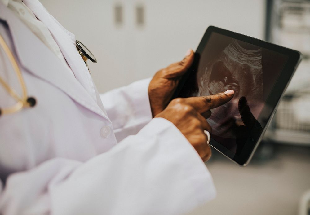 Midwife looking at a sonogram