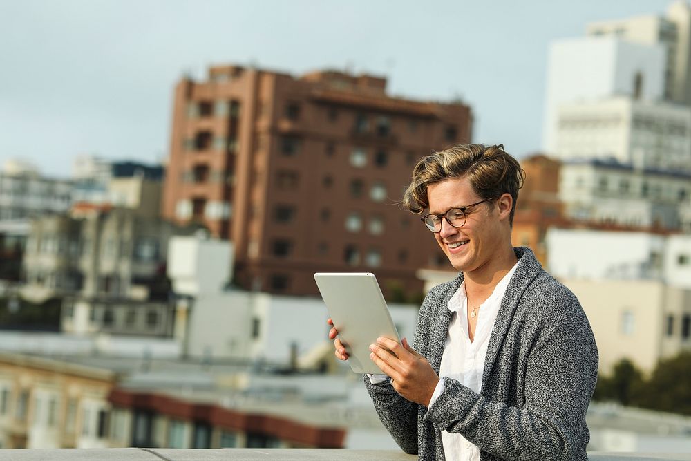 Man using a digital tablet at a rooftop in San Francisco