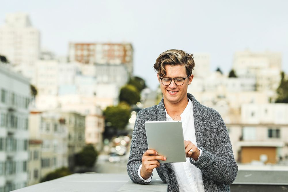 Man using a digital tablet at a rooftop in San Francisco