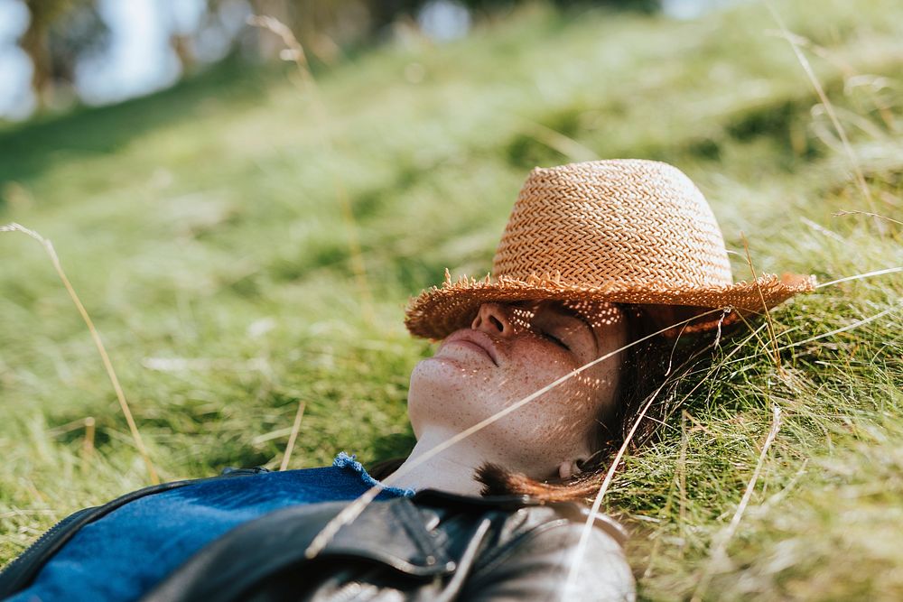 Woman taking a nap on the grass