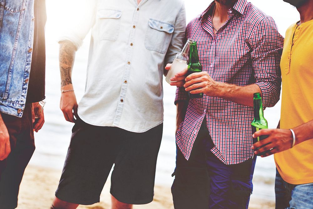 Friends having beers on the beach