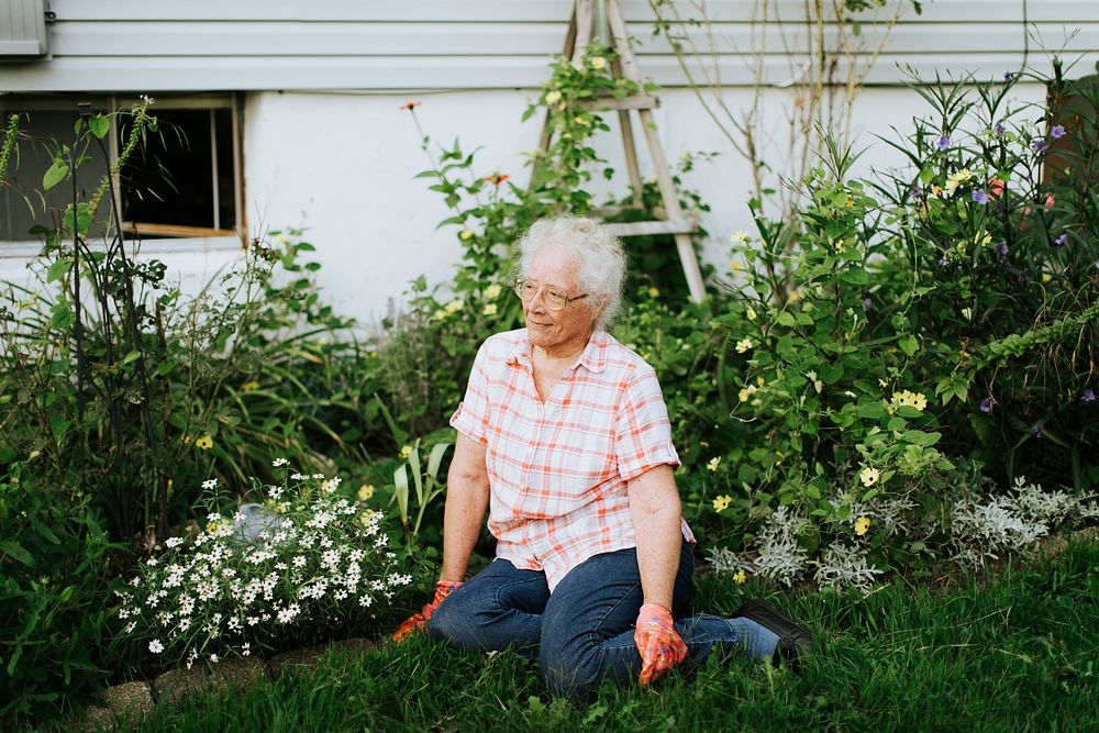 Happy senior woman in her garden