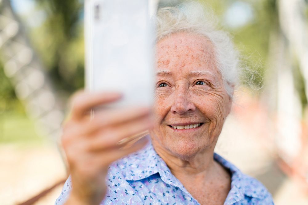 Sweet senior woman taking a selfie