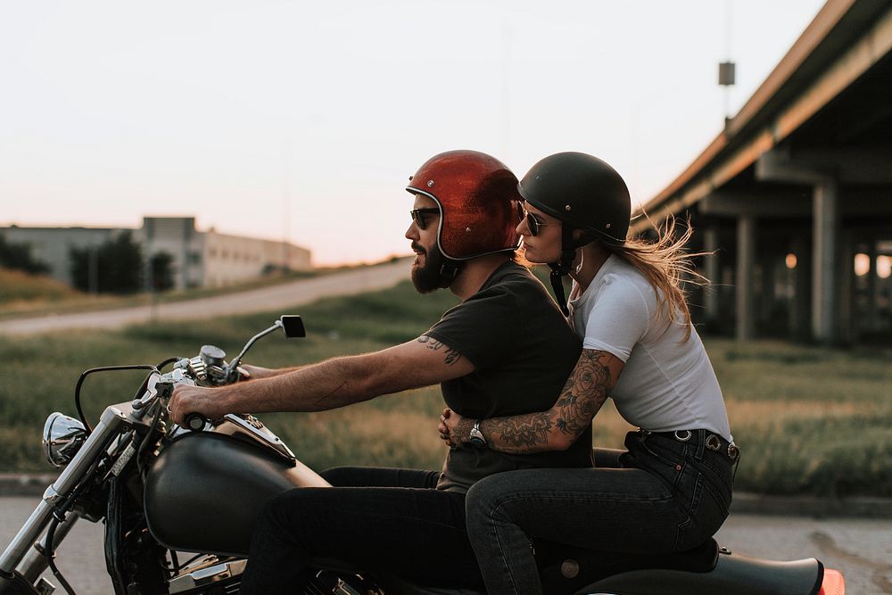 Biker couple riding road sunset | Premium Photo - rawpixel
