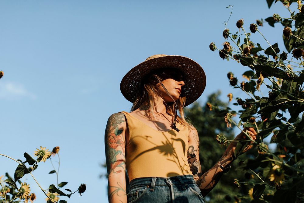 Girl with tats in a garden