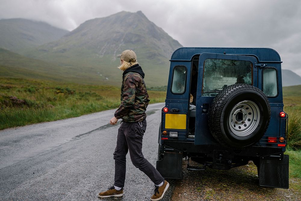 Man on a road trip through the Highlands