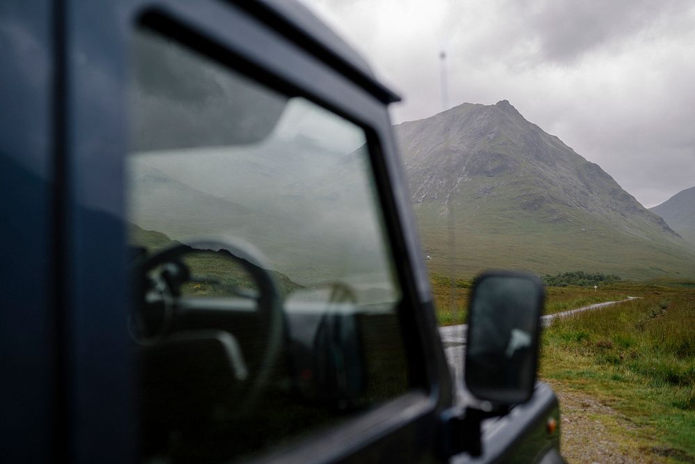Blue SUV in the Scottish Highlands