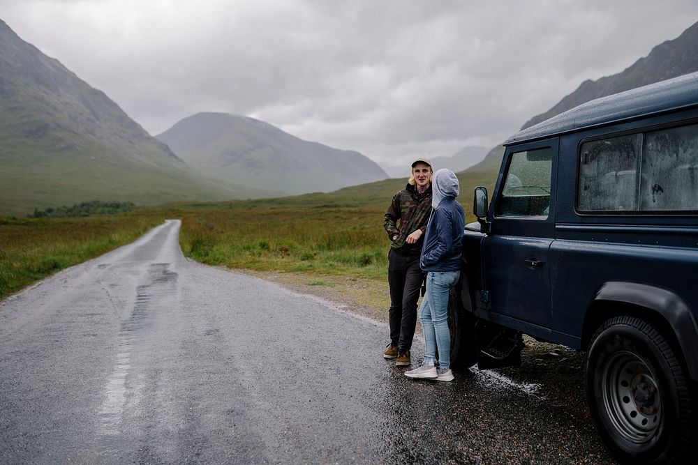 Couple by their parked car