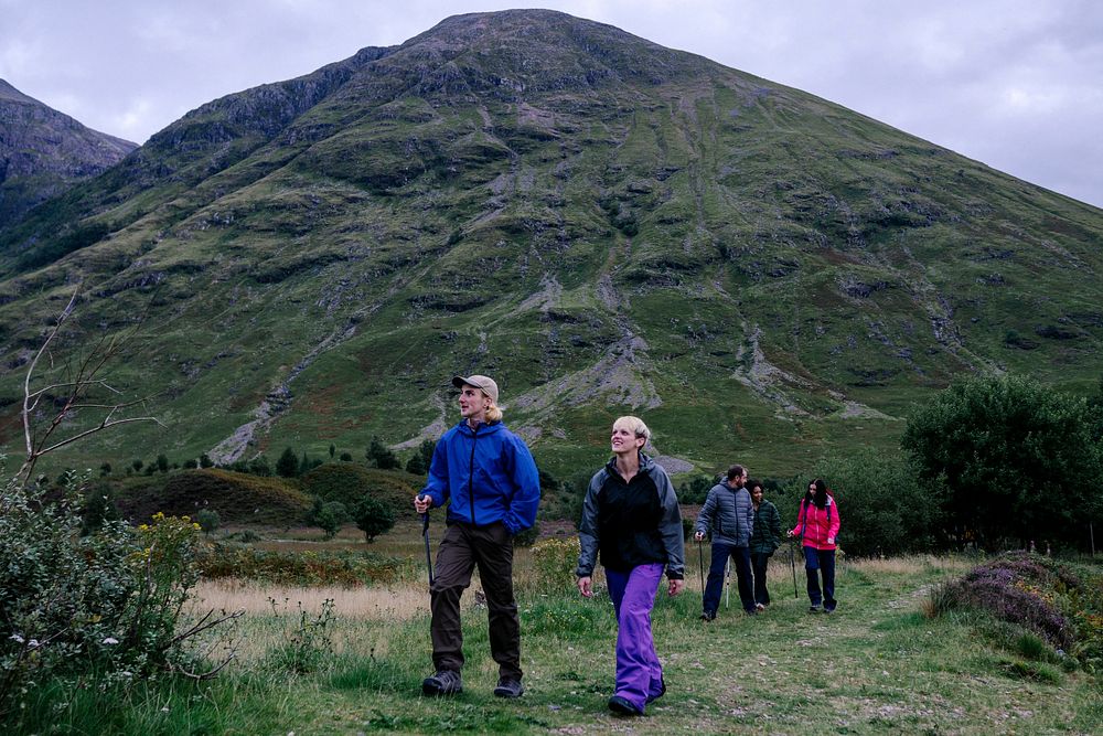 Group of friends trekking in Glen Etive, Scotland