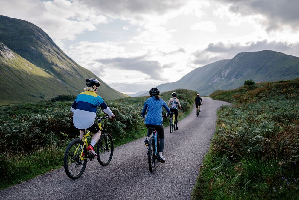 Group of cyclists in Glen Etive, Scotland