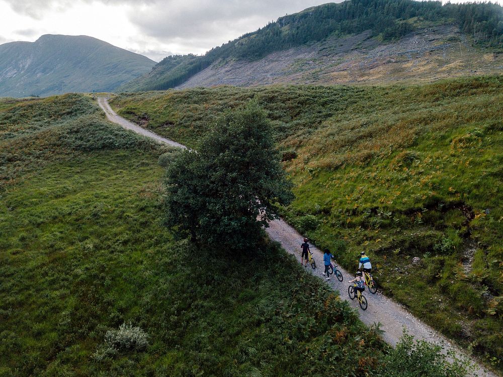 Group of cyclists in Glen Etive, Scotland