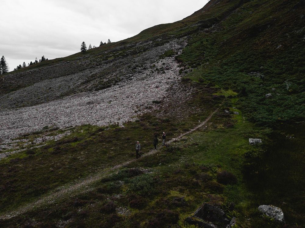 Hikers in the rough terrain of Glen Etive