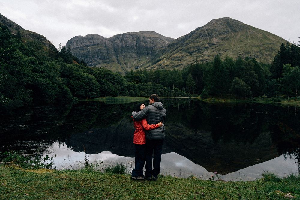 Couple hugging by the riverside in the Highlands