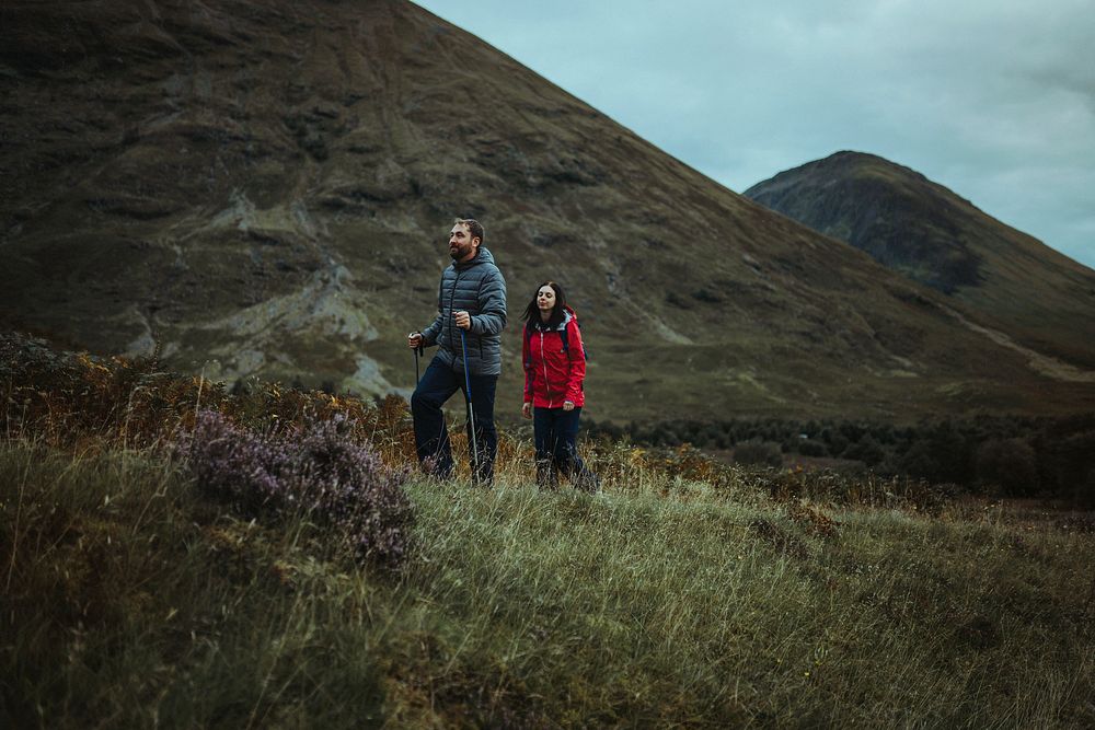 Couple trekking in Glen Etive, Scotland