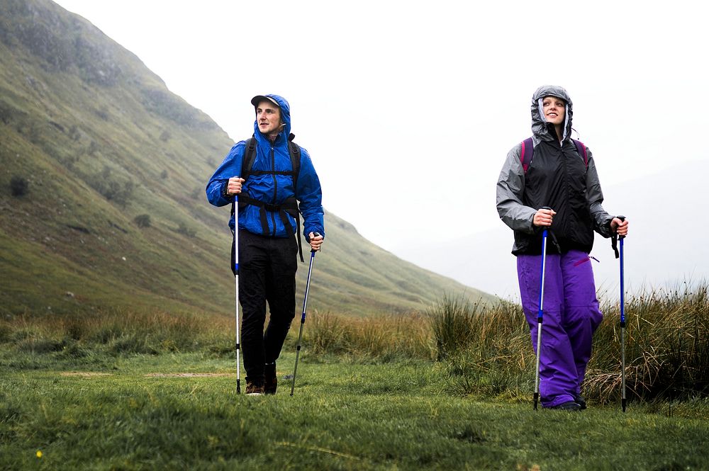 Hikers walking with trekking poles