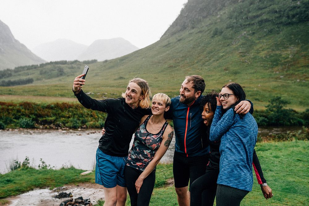 Group of athletes taking a selfie in the nature