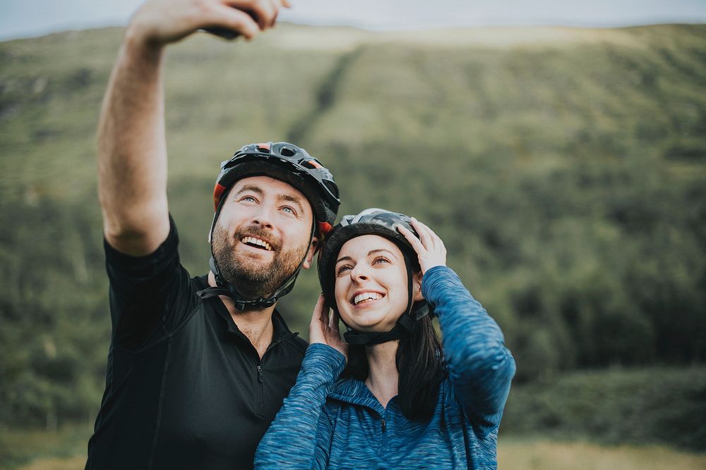 Couple taking a selfie on a bike ride