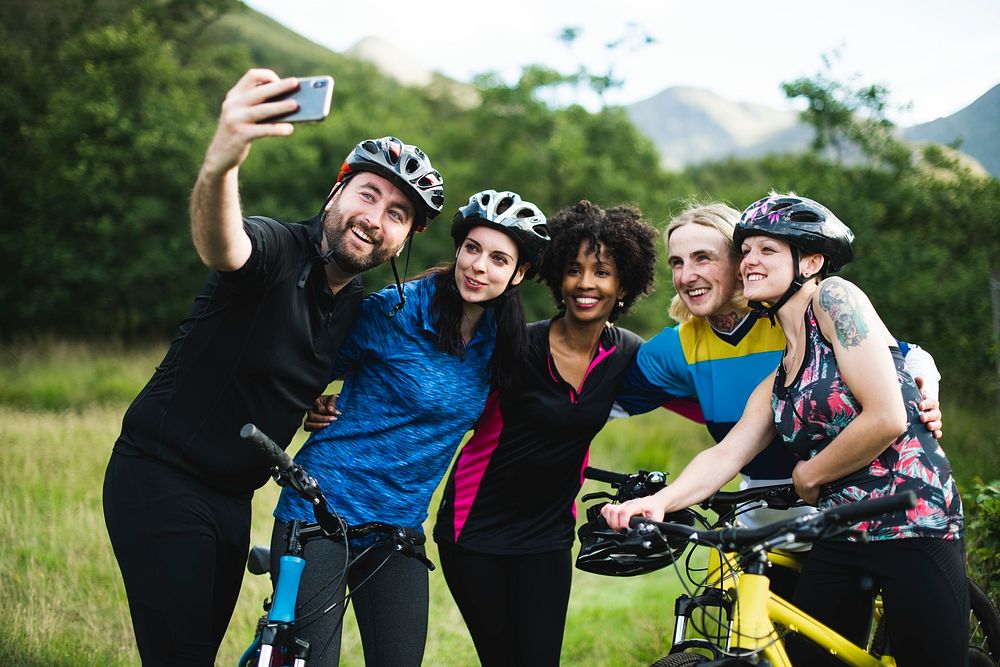 Group of cyclists taking a selfie in the nature