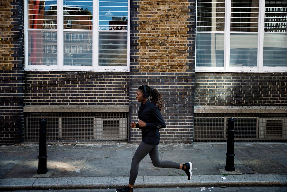 Woman jogging through the city