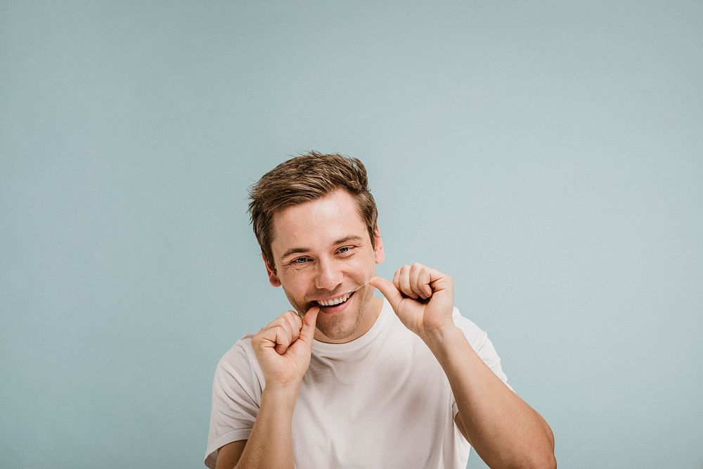 Man using a dental floss