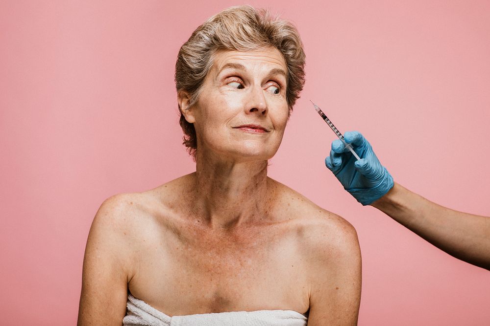 Senior woman getting a botox injection