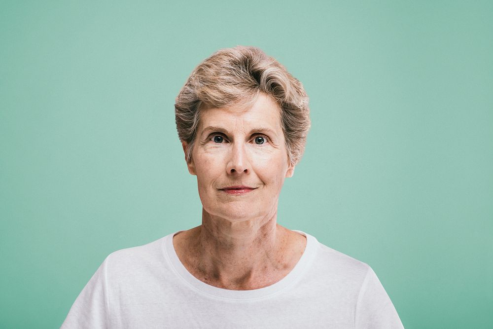 Portrait of an elderly woman in a white tee