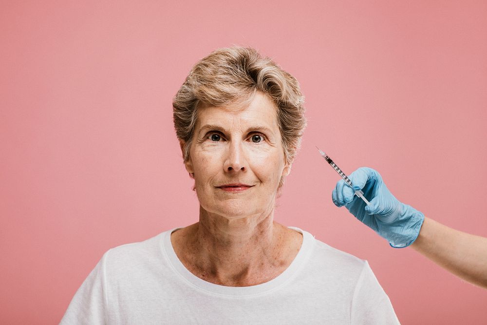 Senior woman getting a botox injection