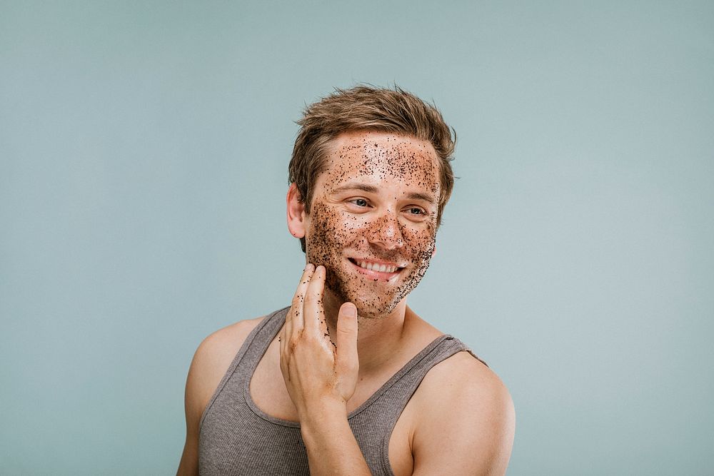Happy man scrubbing his face